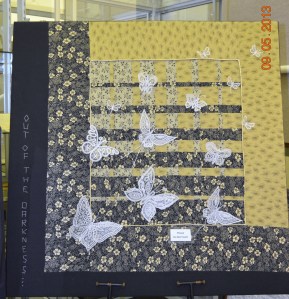 Lace butterflies on quilt